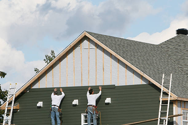 Professional Siding technician working in Farmingdale, NY